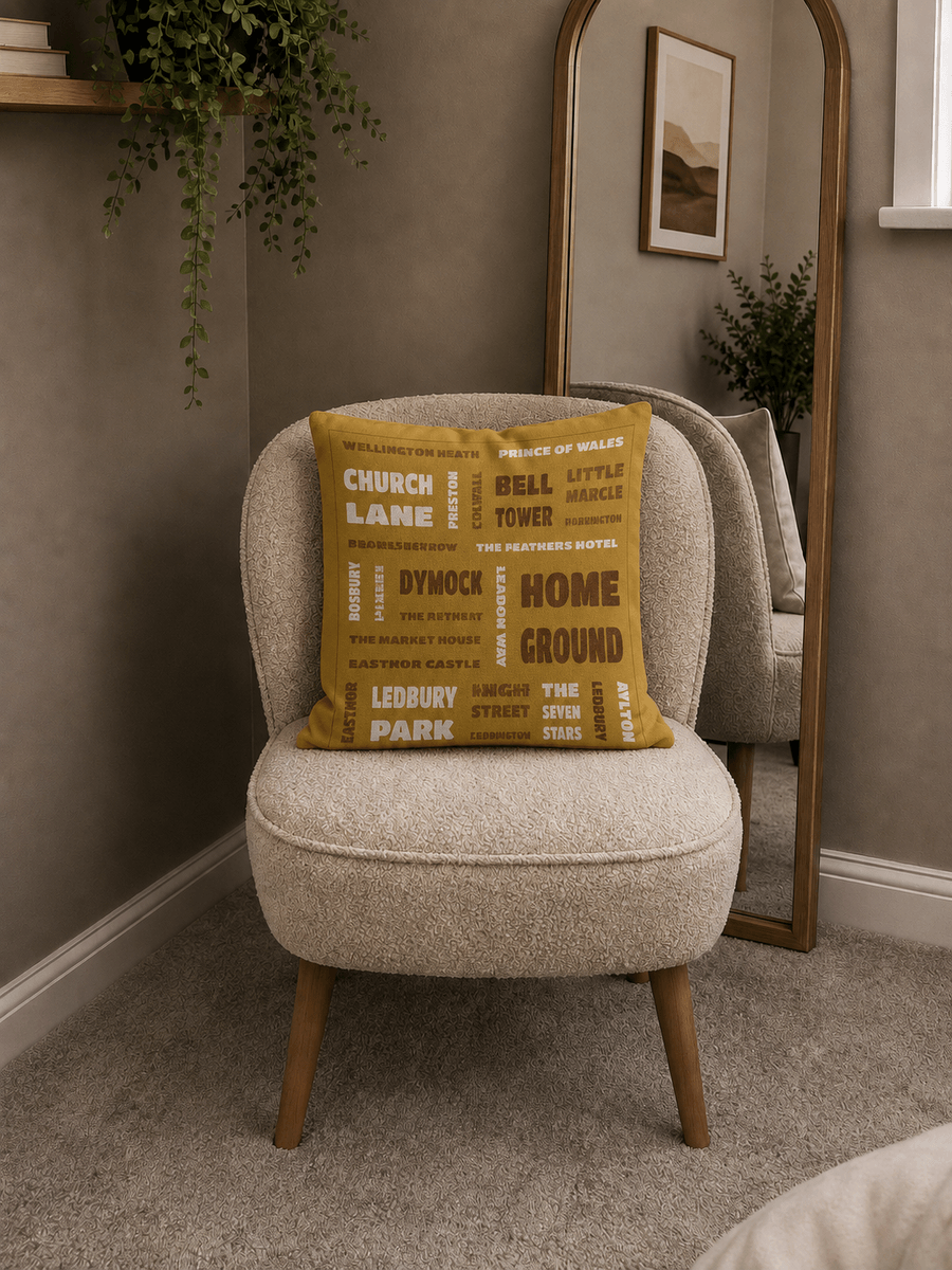 A Pitchabode postcode cushion on a bouclé armchair
