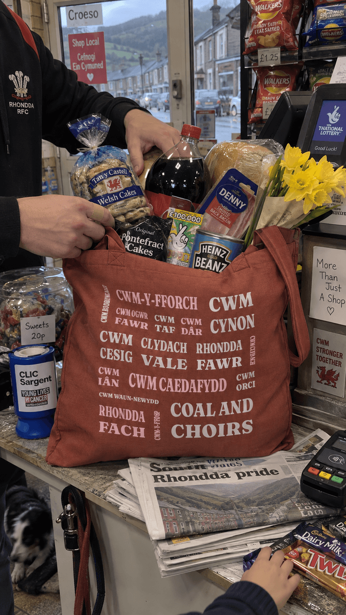 A Pitchabode postcode tote bag being filled at a corner shop