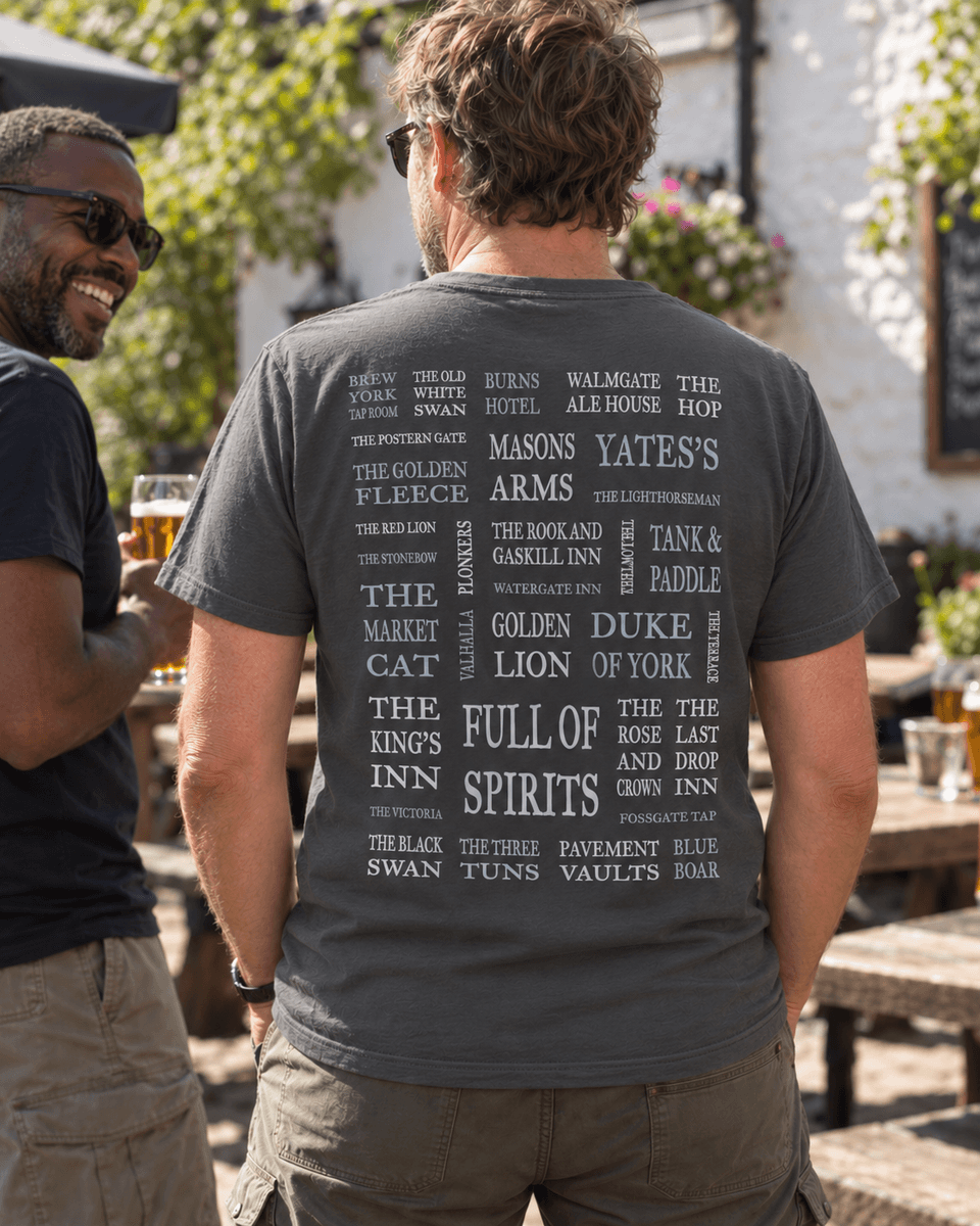 A Pitchabode postcode t-shirt worn in a pub courtyard